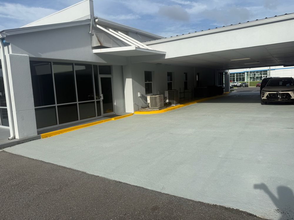A freshly pressure-washed commercial drive-through in Tallahassee